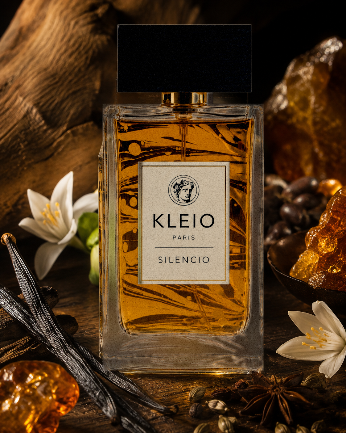 KLEIO Paris Silencio eau de parfum, amber bottle with black cap among warm woods, white flowers and amber-toned campaign elements.